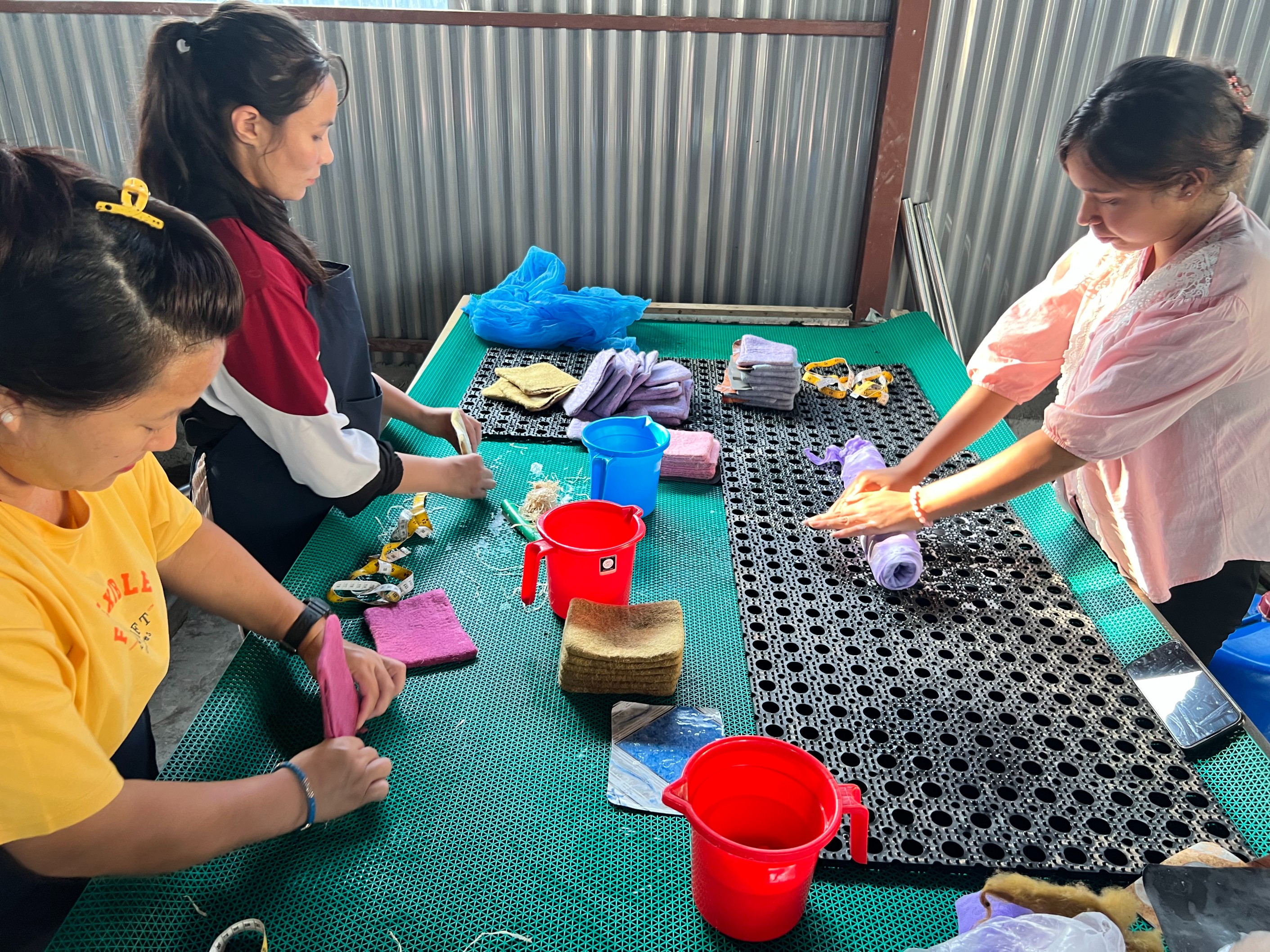 Skilled Nepali woman crafting handmade textile